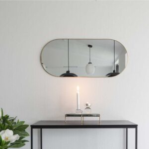 Cutty - Ovalt spejl i størrelse 35 x80 cm, messing